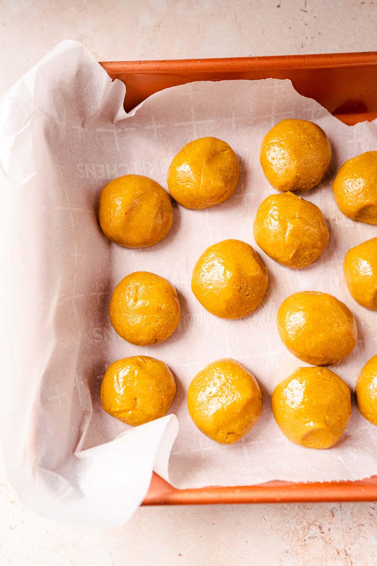 A pan filled with rolled golden milk bites.