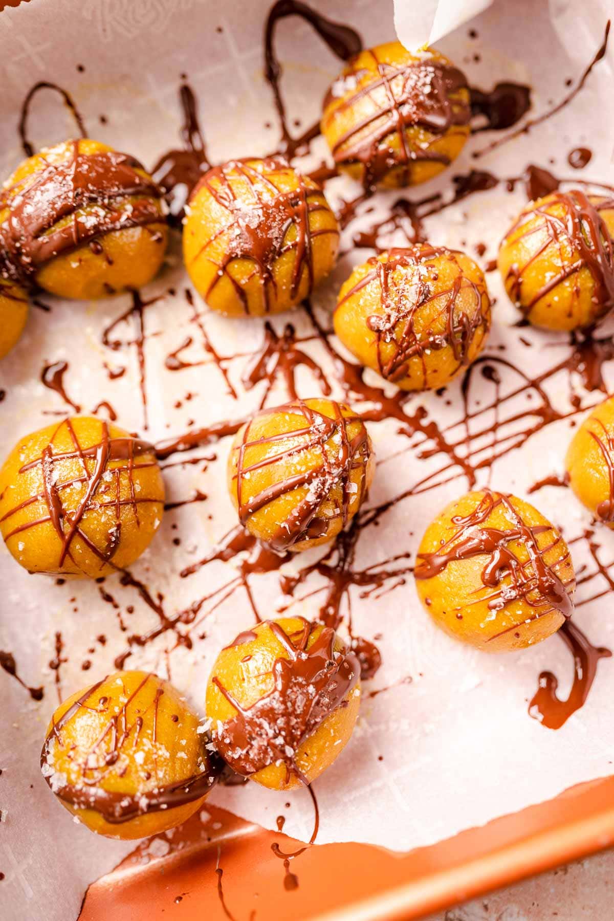 Golden milk bites drizzled with chocolate and sea salt.