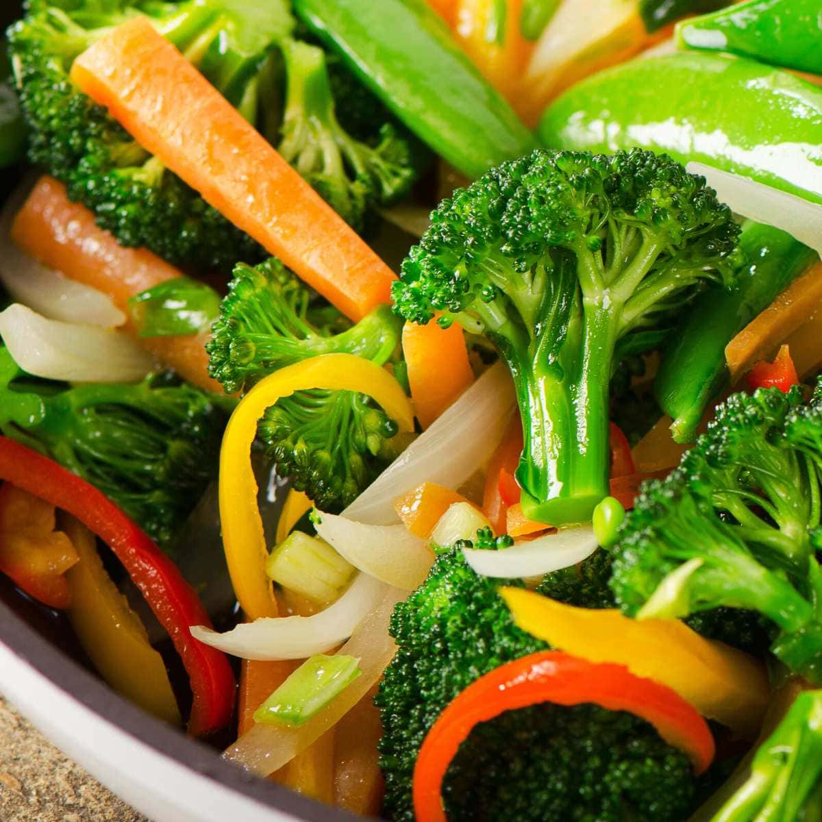 A close shot of sauteed vegetables in a bowl.