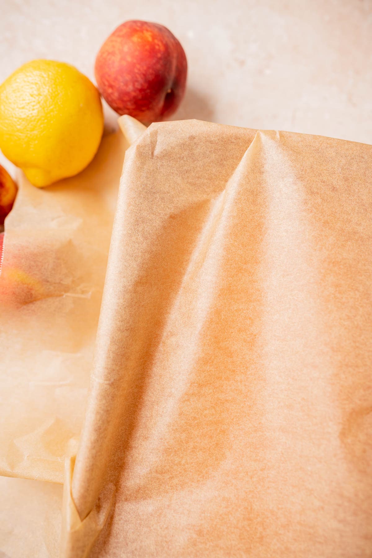 A loaf pan covered with brown parchment paper.