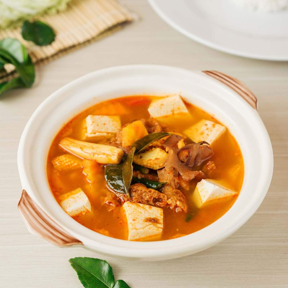 Tom Yum Soup in a white bowl.