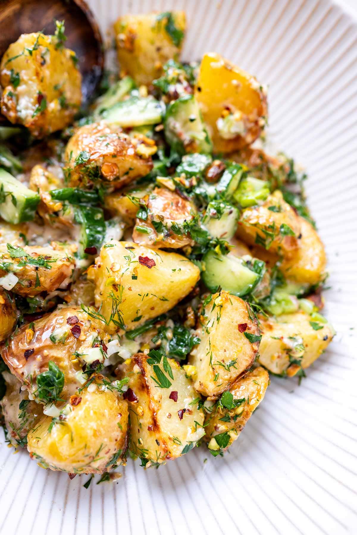 A close shot of a homemade roasted potato salad.