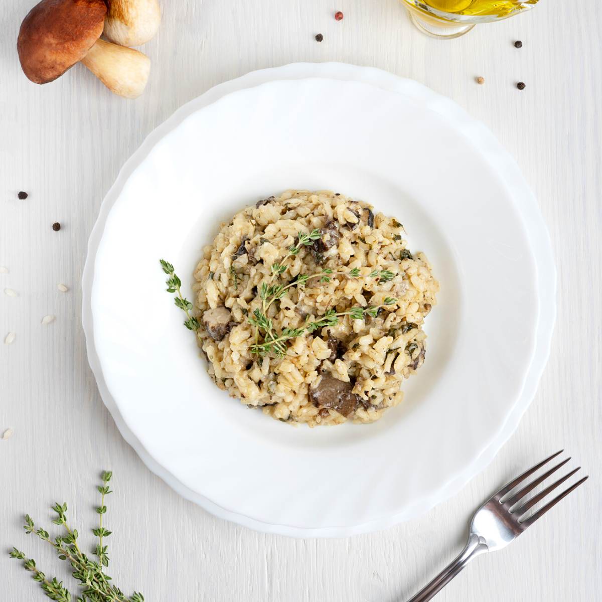 A white dish with vegan mushroom risotto.