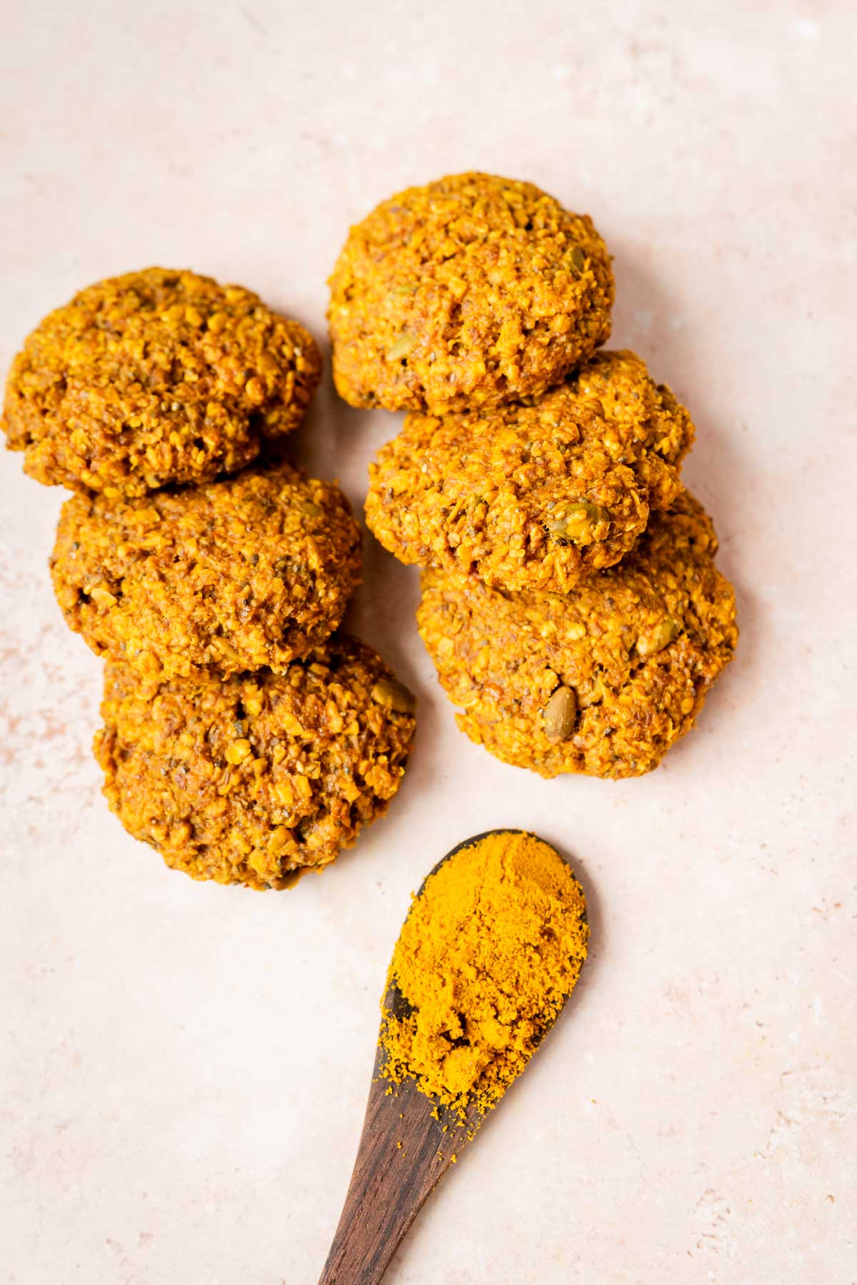 Golden milk breakfast recipe featuring turmeric cookies served with a spoon.
