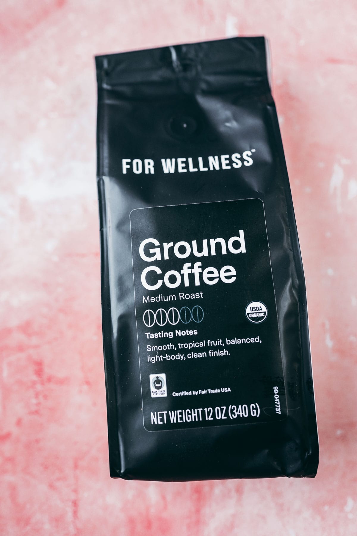 A bag of For Wellness organic ground coffee.