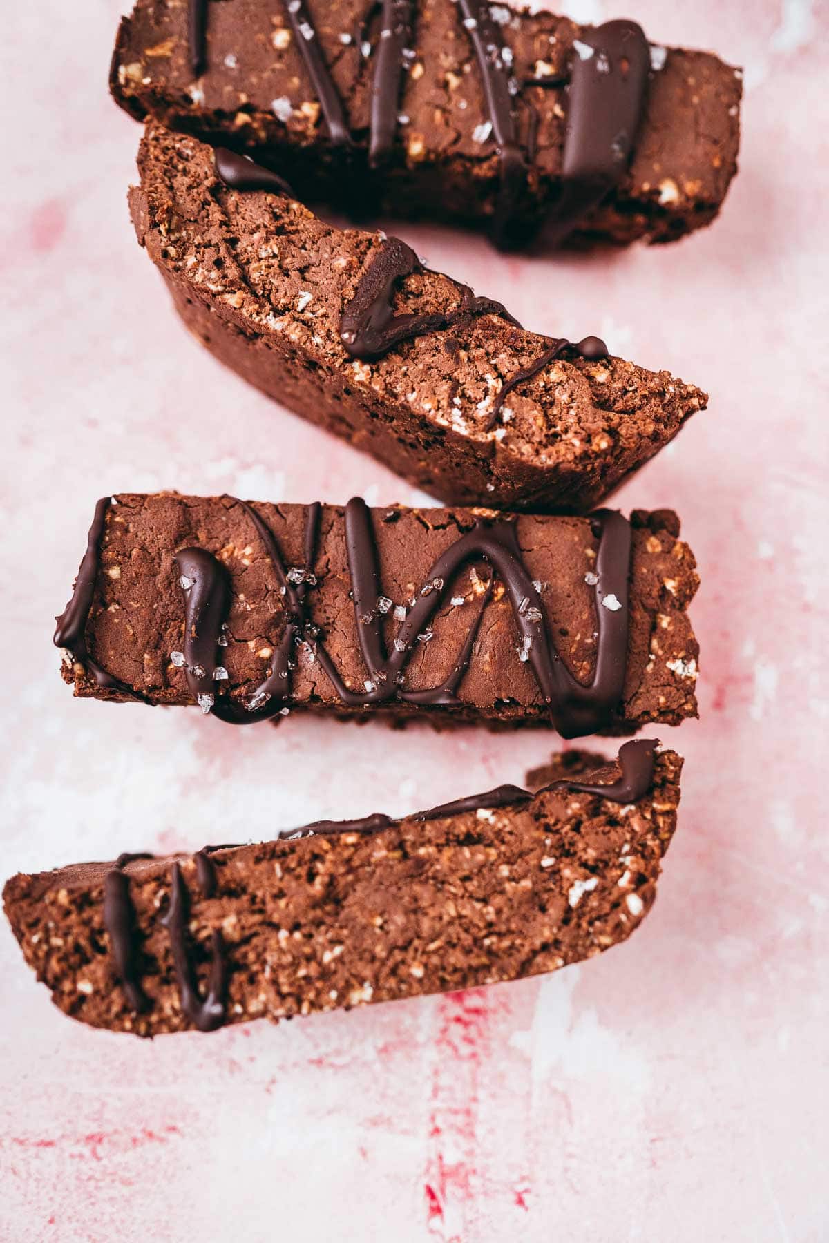 Four mocha protein bars drizzled with chocolate and sprinkled with salt.