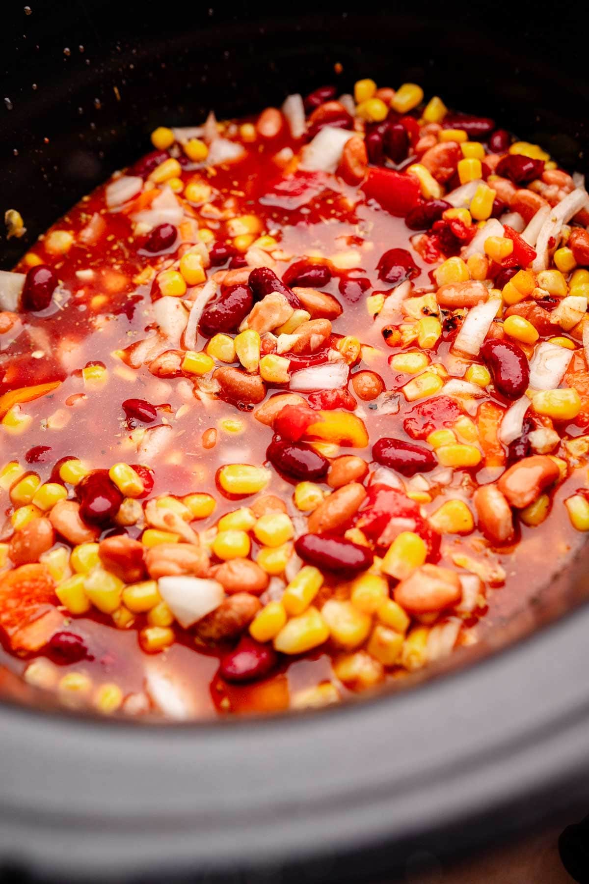 A slow cooker full of vegetarian chili.