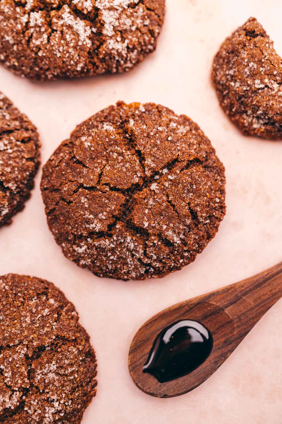 Gluten-free gingerbread cookies with molasses on a pink background.
