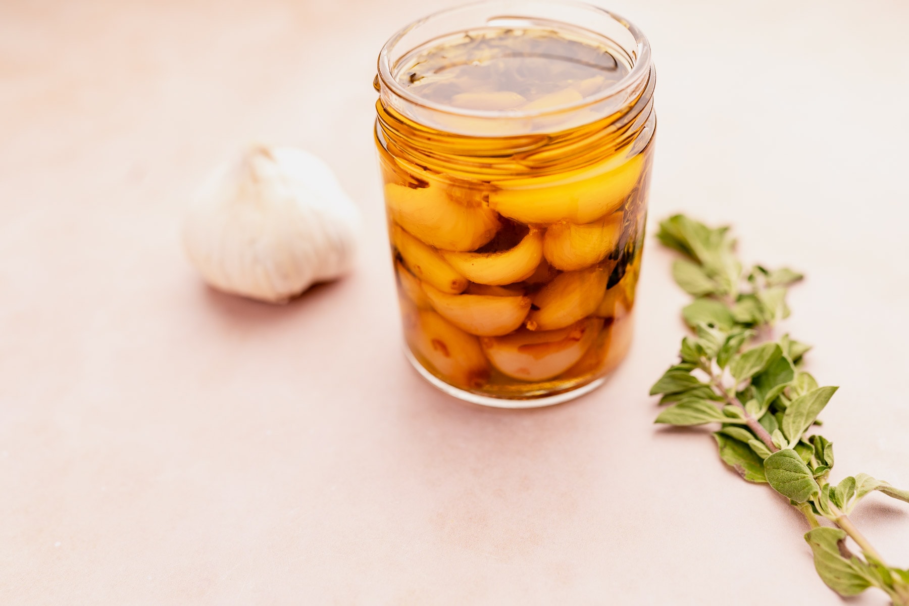 Olive oil in a jar with garlic confit.