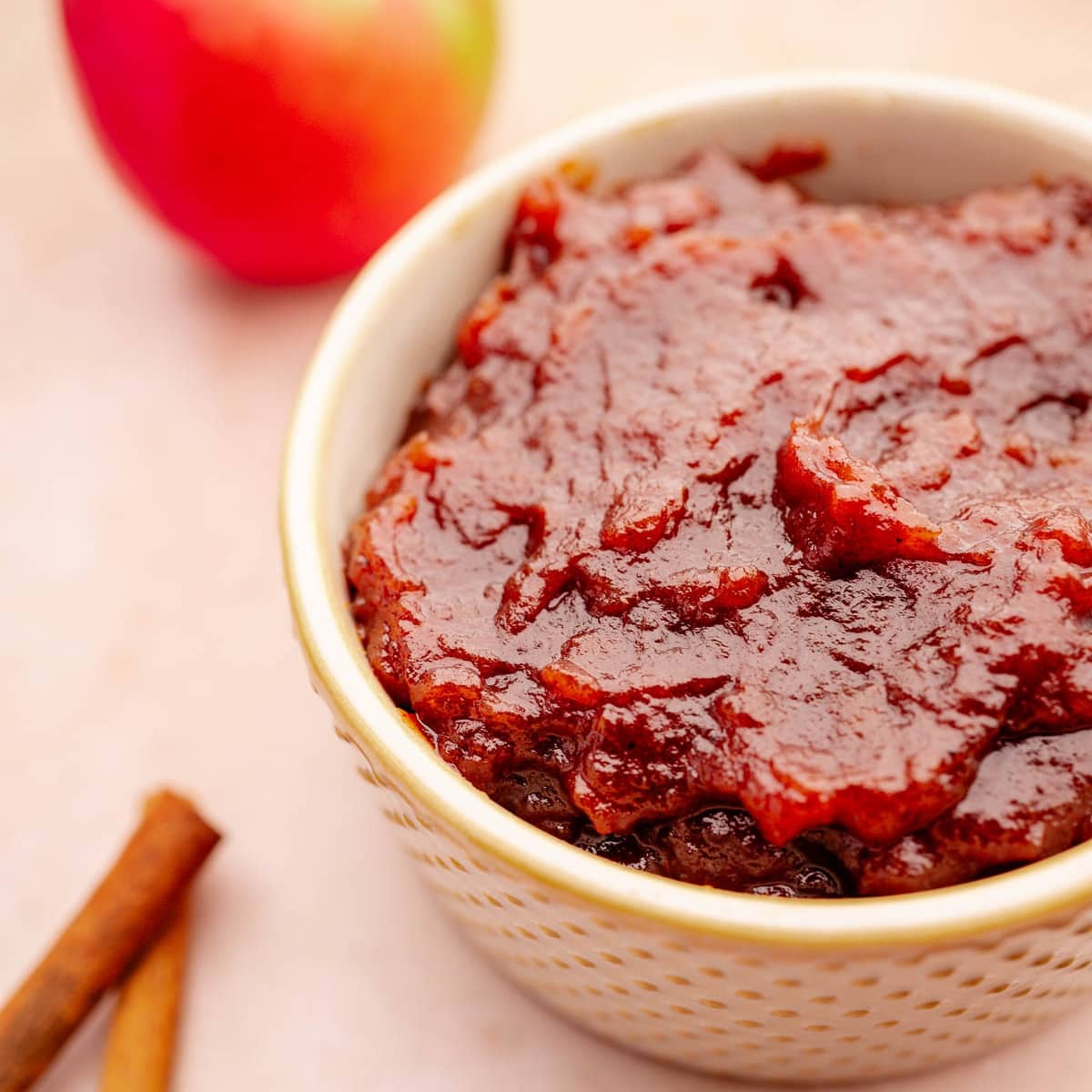 Slow cooker apple butter with cinnamon sticks.
