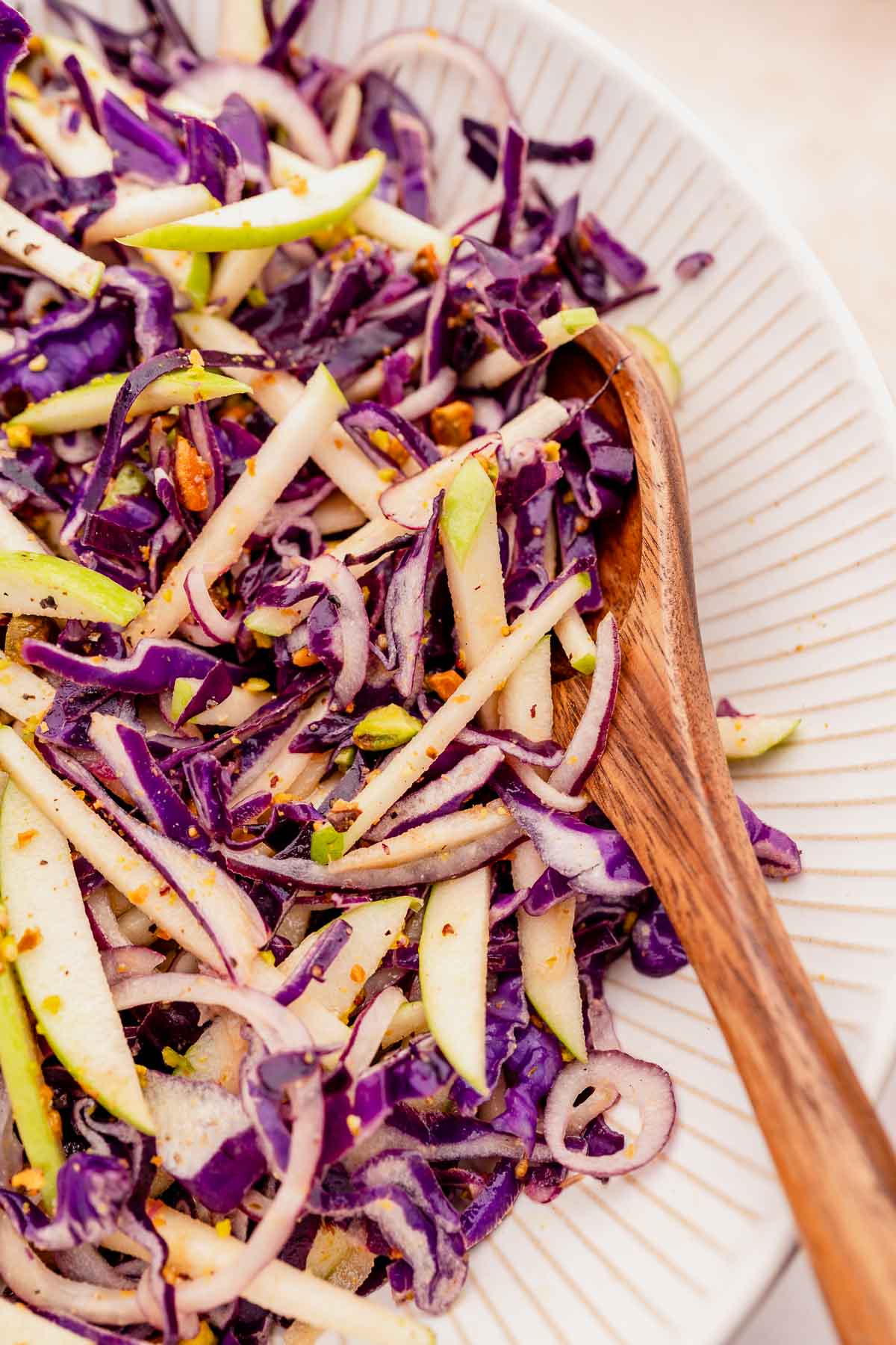 A refreshing slaw made with red cabbage, crisp apples and crunchy walnuts.