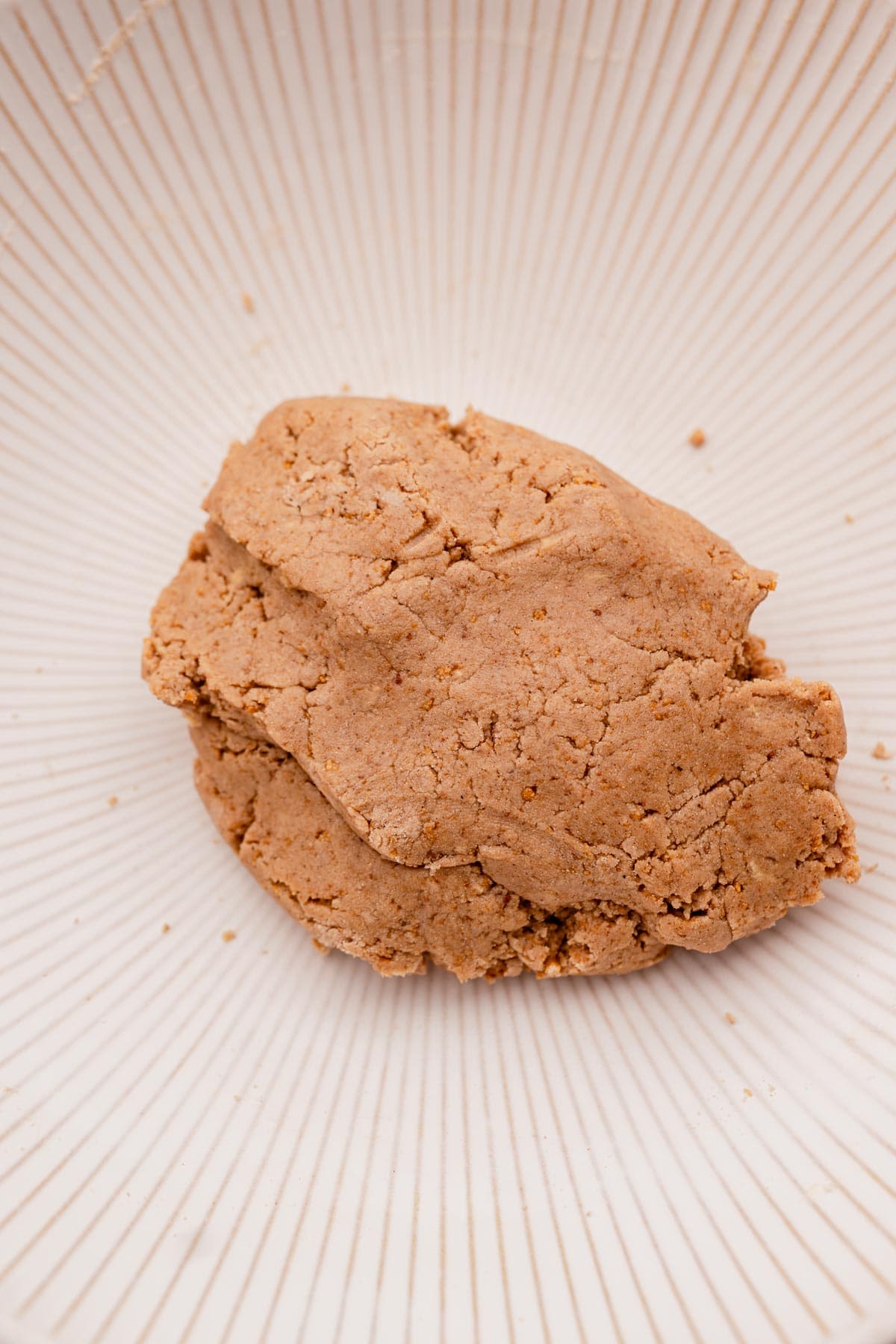 A piece of ginger cookie on a plate.