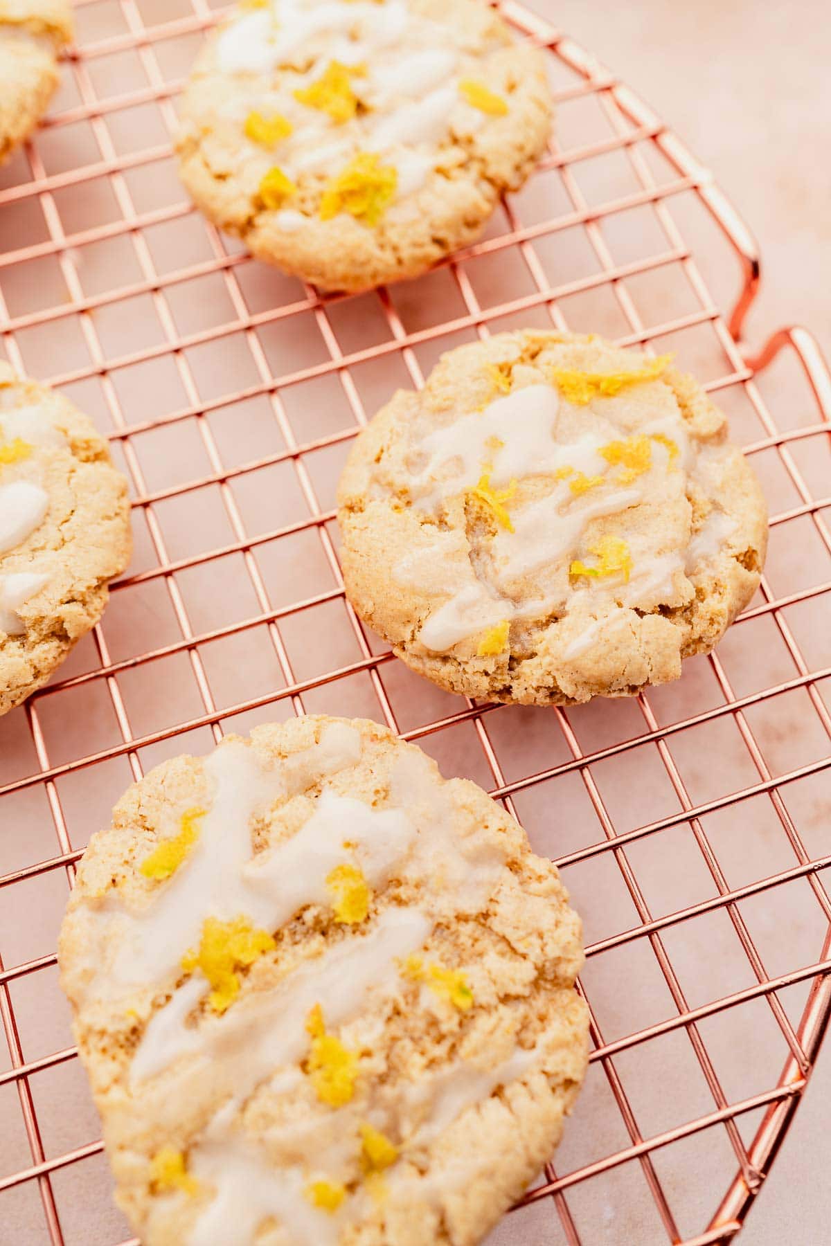Gluten free lemon icing cookies on a cooling rack.