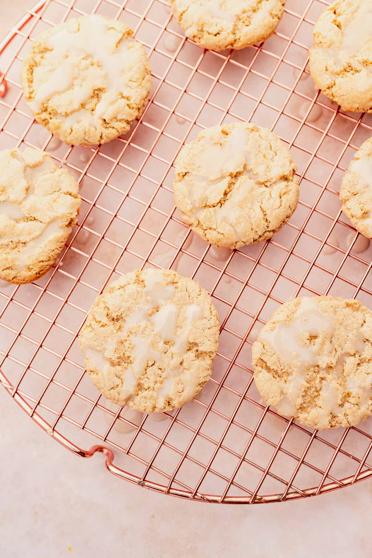 Gluten-free lemon icing cookies on a cooling rack.