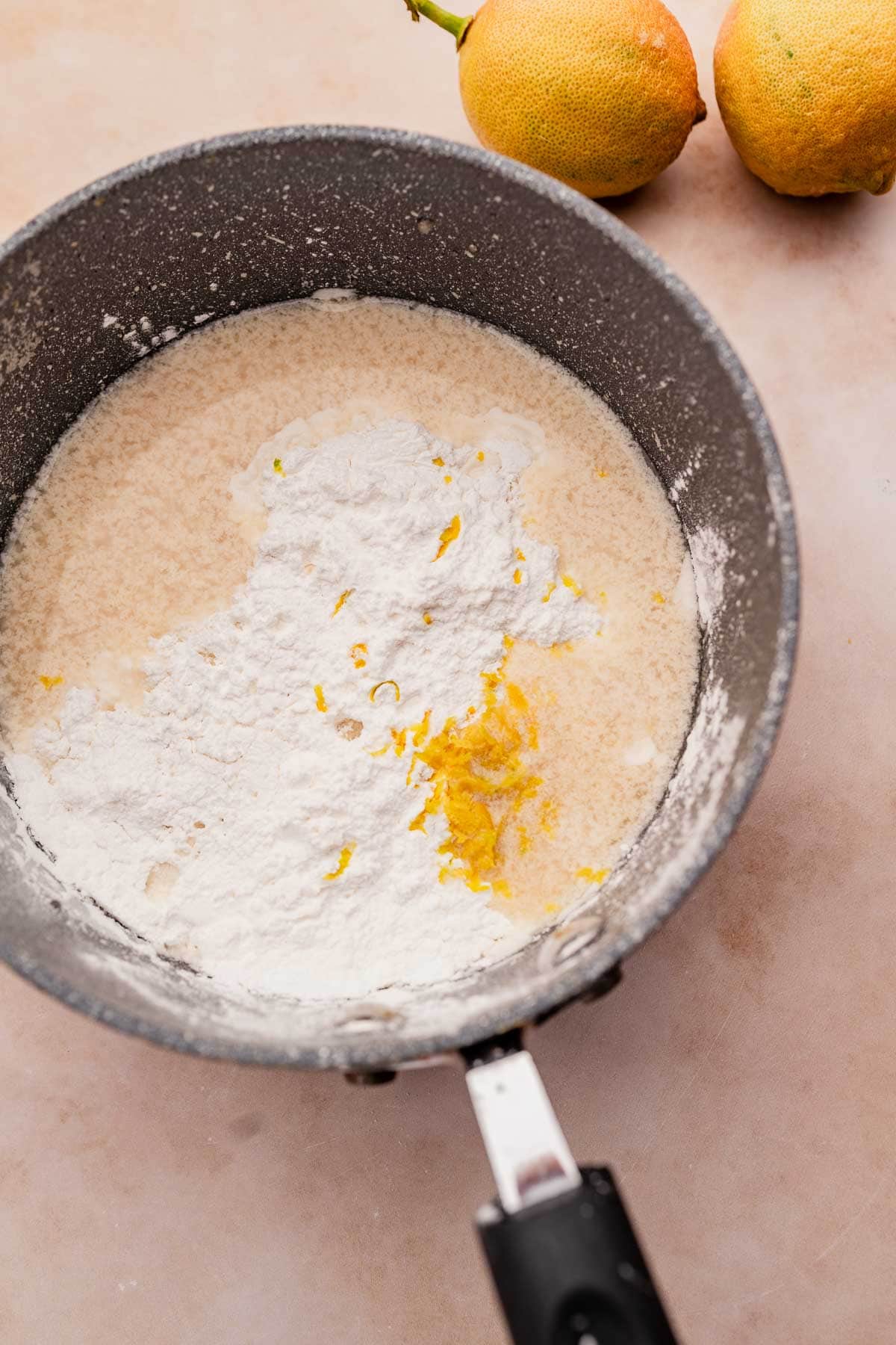 A vegan lemon curd made using a frying pan, flour, and lemons.