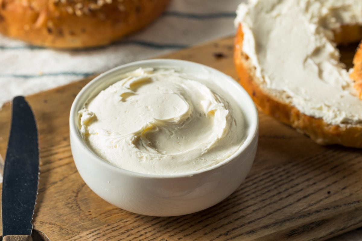 A small white bowl of cream cheese.