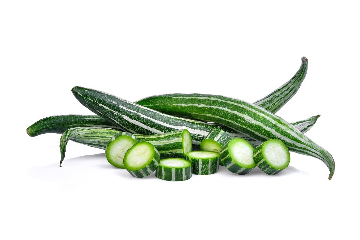 A pile of cucumbers on a white background.