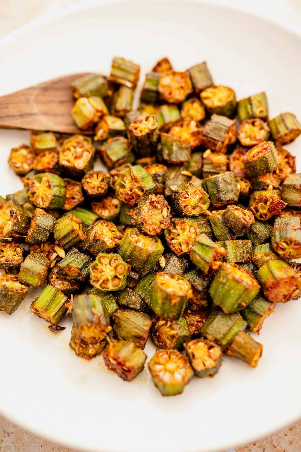 Plate of cooked okra recipe with seasoning.
