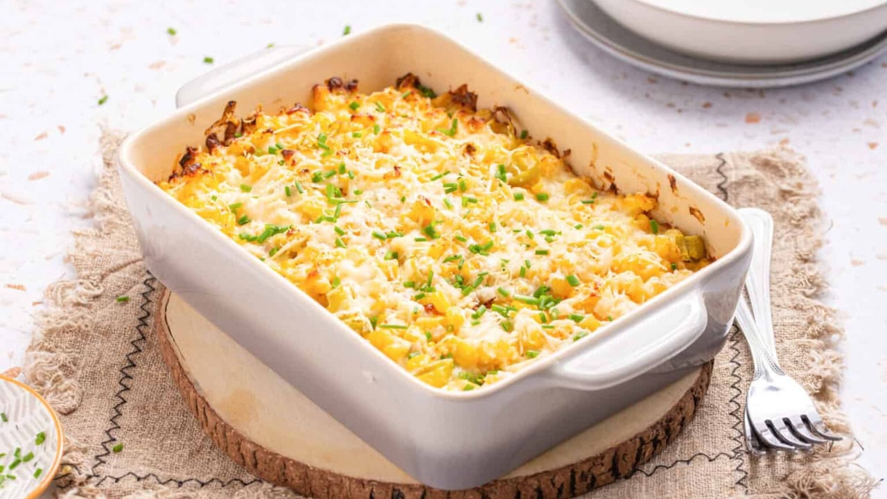 An image of corn casserole with cream cheese, ready to be served.
