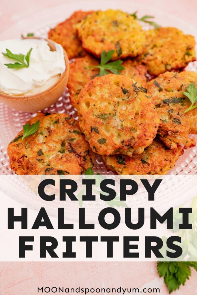 Plate of crispy halloumi fritters with a side of dip, garnished with parsley.