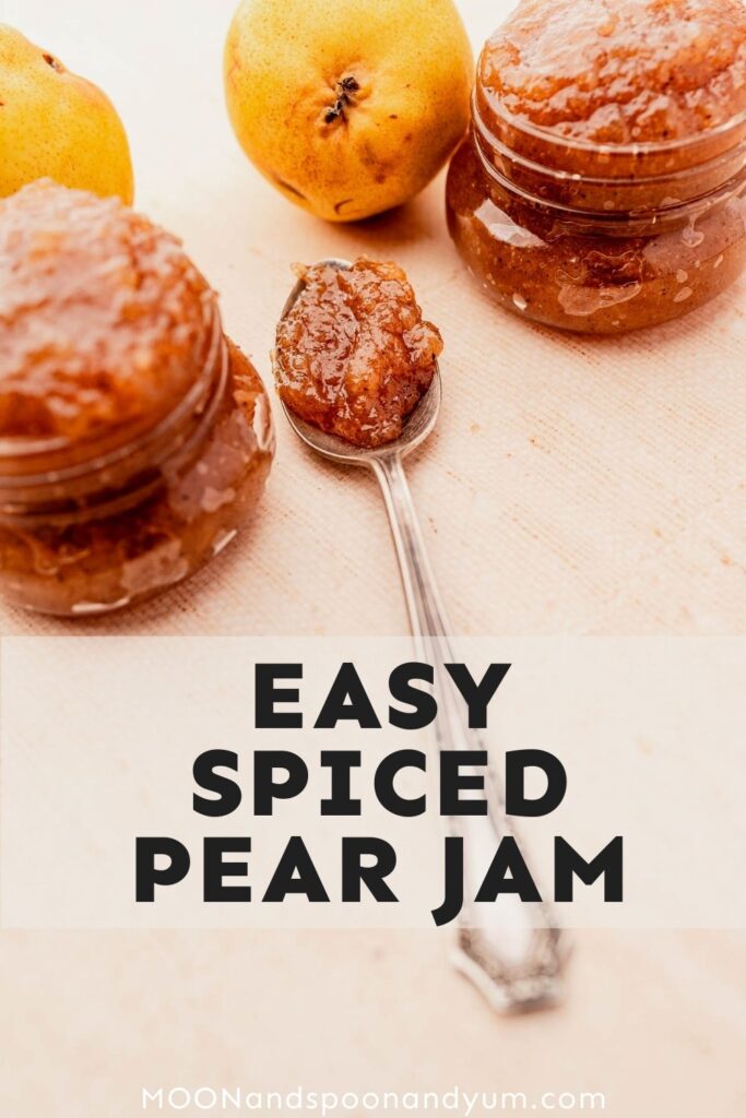Jars and a spoon of spiced pear jam on a light surface, with whole pears in the background. Text reads "Easy Spiced Pear Jam".