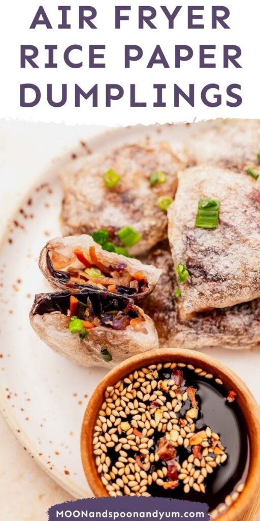 Air-fried rice paper dumplings served with a bowl of soy sauce topped with sesame seeds on a speckled plate.