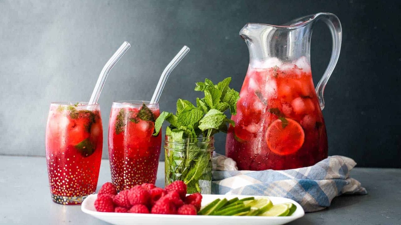 Raspberry mojito cocktails with a mojito party pitcher.