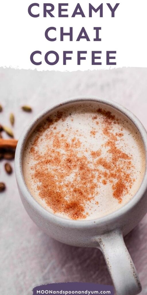 A mug of creamy chai coffee topped with cinnamon on a light surface, with text reading "Creamy Chai Coffee" above.