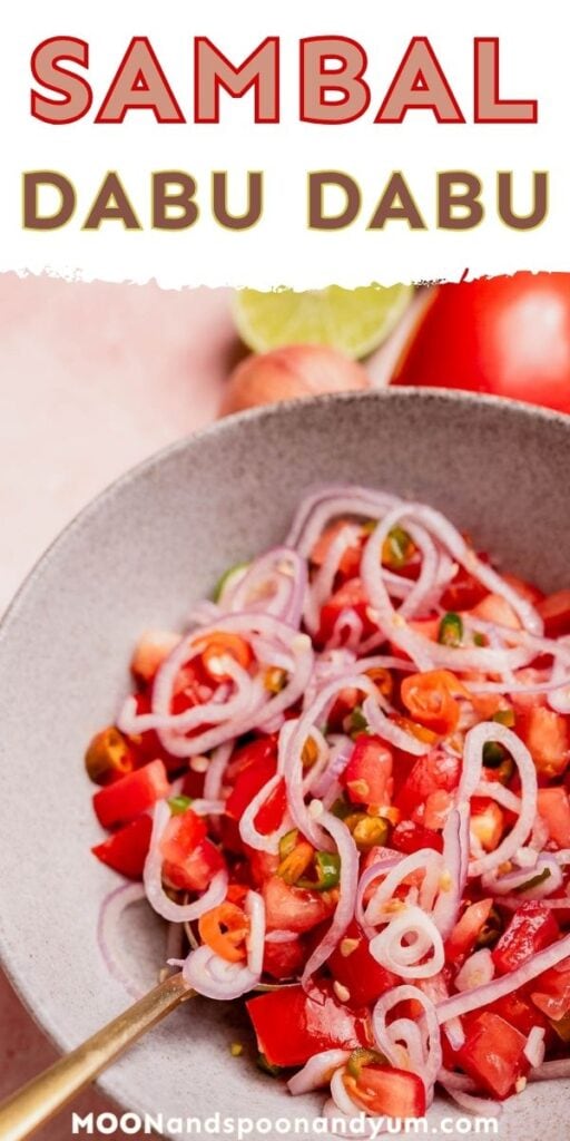 A bowl of sambal dabu dabu, a zesty Indonesian raw chili salsa, featuring sliced red onions, tomatoes, and green chilies.