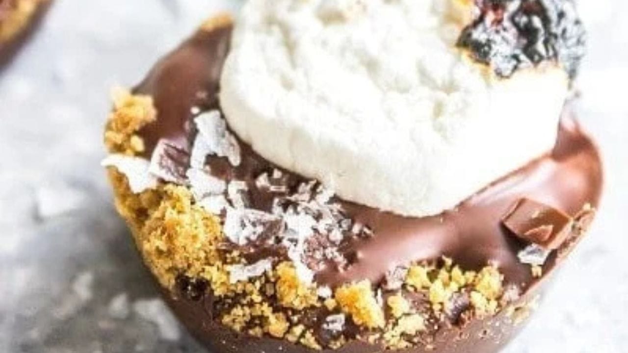 A chocolate dessert with chocolate and whipped cream on top.