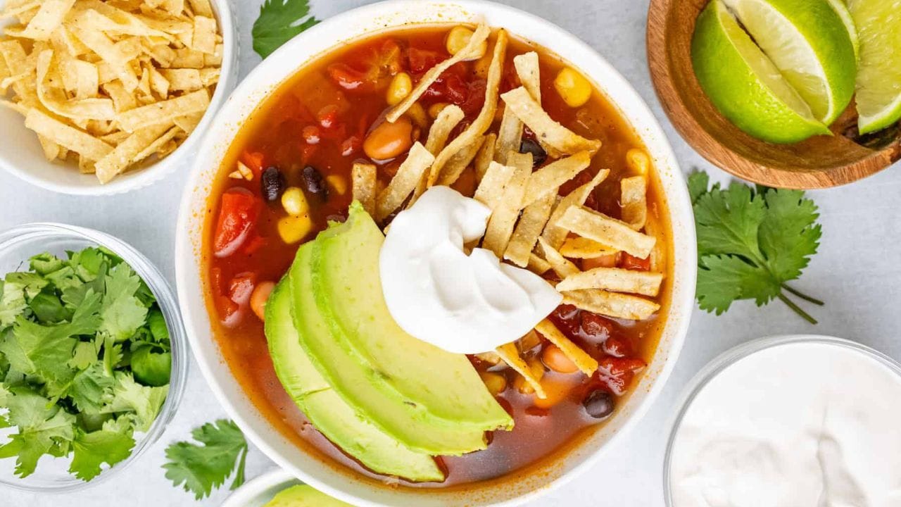 Top view of a bowl of slow cooker tortilla soup.