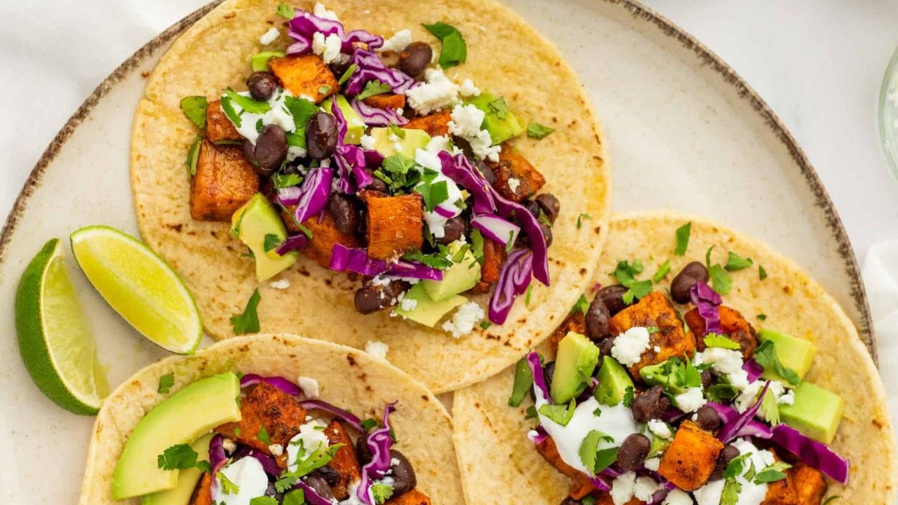 An overhead image of three sweet potato black bean tacos.