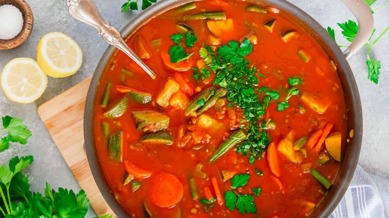 Mung bean soup in a bowl with gold spoon.