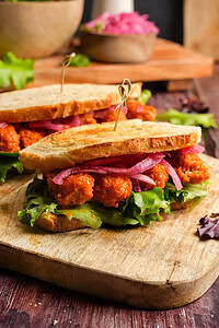 A sandwich on a cutting board.