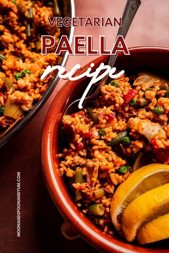 Close-up of Vegetarian Paella in a bowl with lemon wedges, showcasing vibrant rice and vegetables. Visible text reads “Vegetarian Paella Recipe.”.