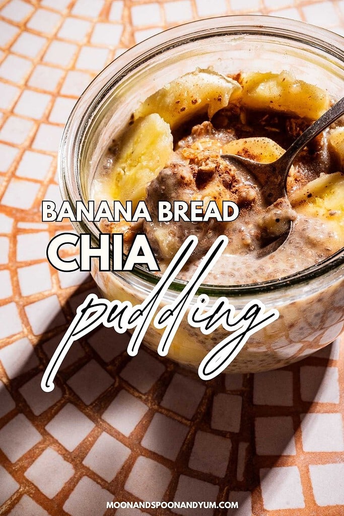 A glass jar filled with banana chia pudding, topped with banana slices and cinnamon, sits on a tiled surface with a spoon inside. Text on image reads "Banana Bread Chia Pudding.