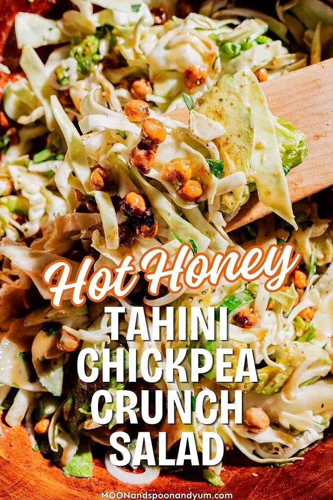 Close-up of a mixed salad with cabbage, chickpeas, and dressing, labeled "Hot Honey Tahini Chickpea Crunch Salad"—a vibrant hot honey salad bursting with flavor and texture.