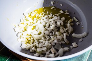 Chopped onions in a pan with olive oil, ready to be cooked—perfect for starting your marry me lasagna soup.